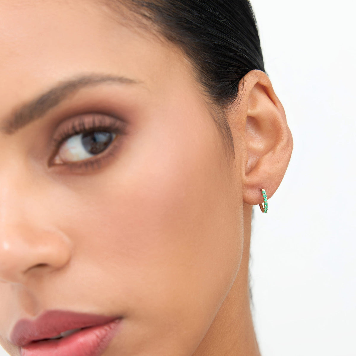 OBFJ1844 - Emerald Huggie Hoop Earrings earrings in selectable metal and diamond options - Roselle Jewelry view 3