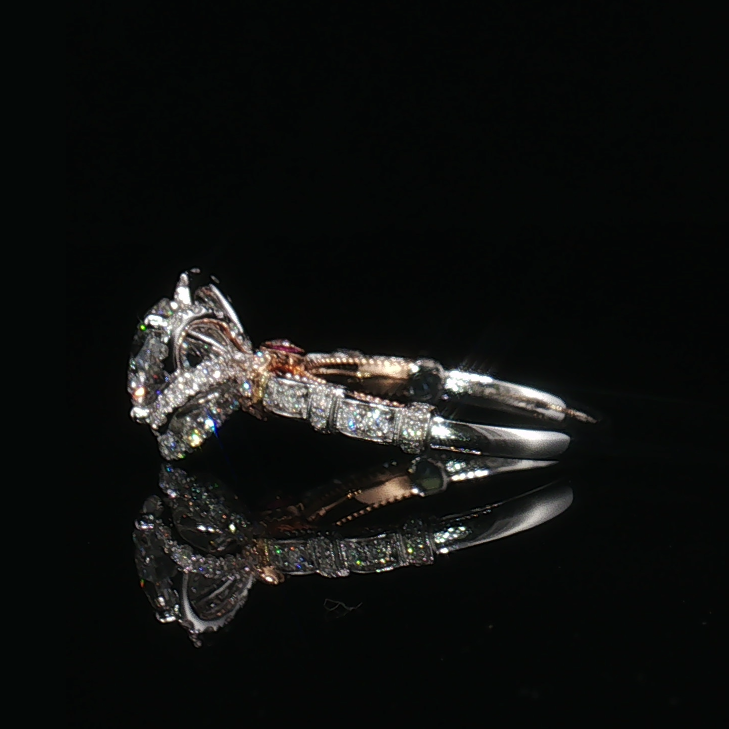 Side view of the floral halo ring showing its raised basket and geometric pavé shoulder details